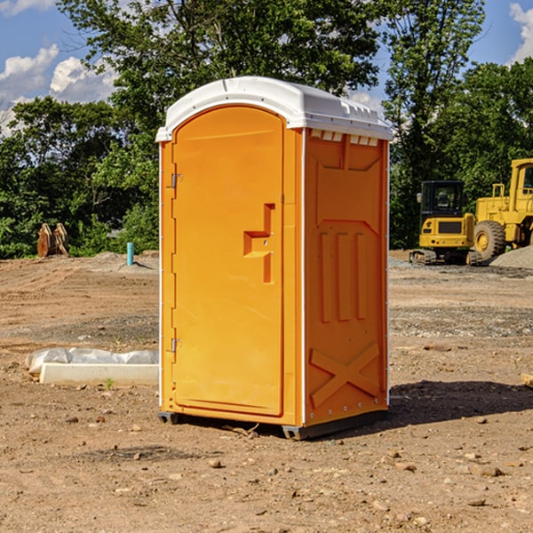 what is the cost difference between standard and deluxe portable restroom rentals in Russell MA